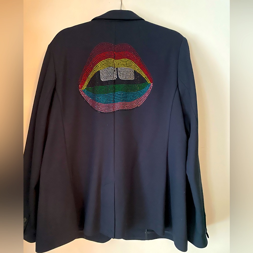 Navy blazer with Rhinestone deca on back.